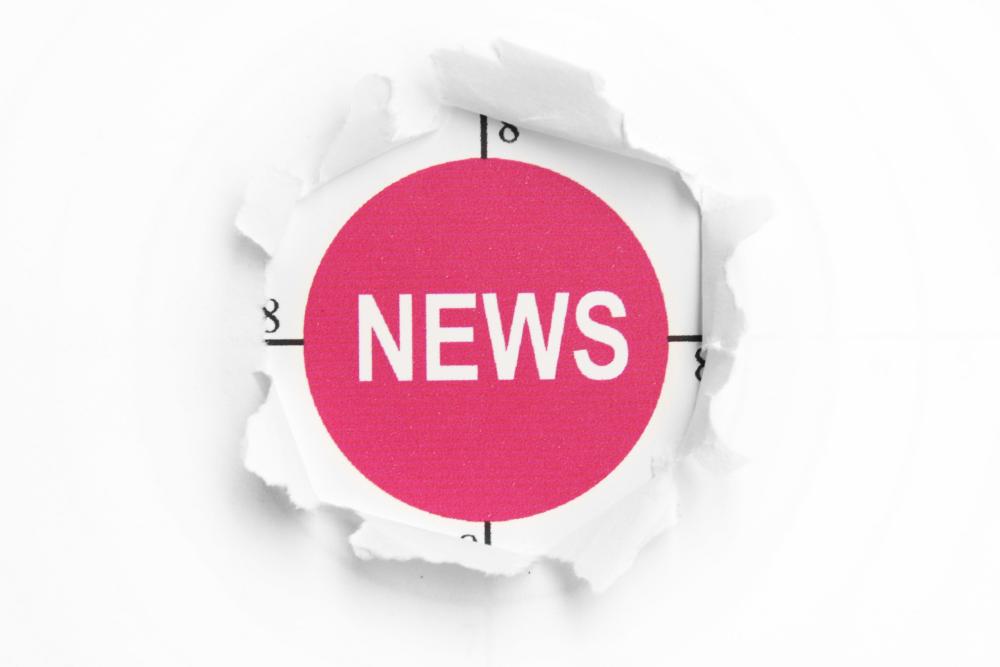 a red button with the word news on it in white lettering