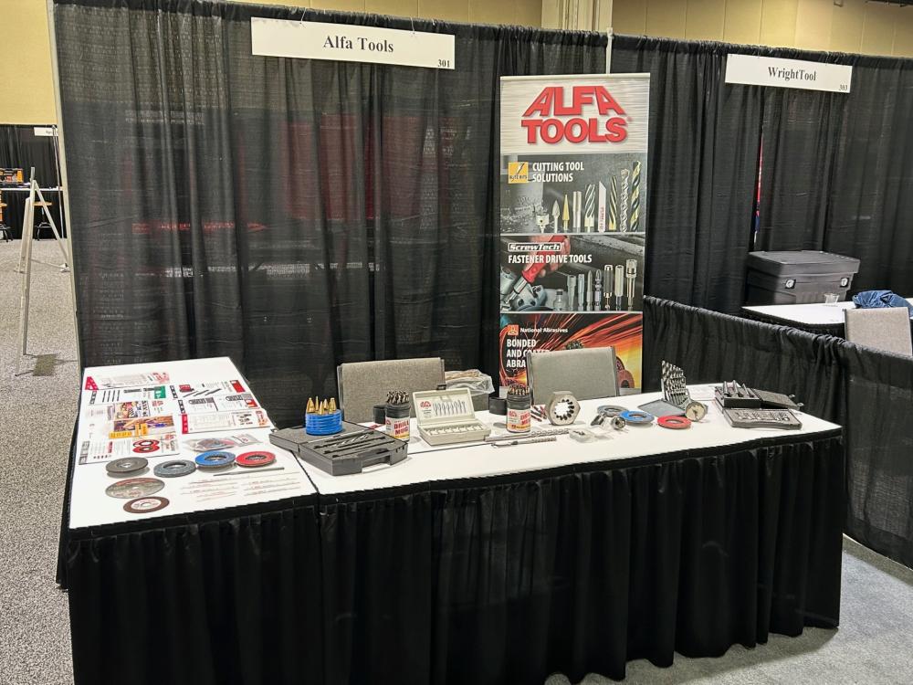 image of an Alfa Tools trade show booth with products on the table